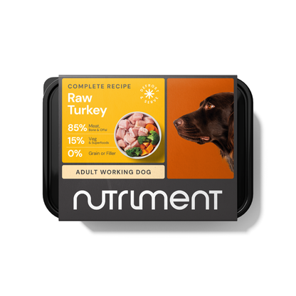 Dog food package labeled "Raw Turkey 500g" featuring fresh meat and a happy dog image.