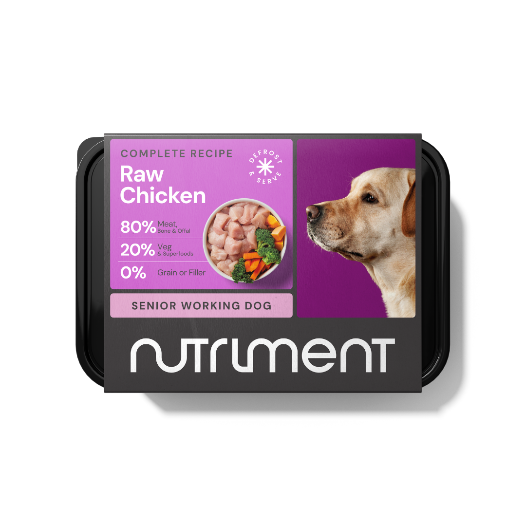 Senior Raw Chicken 500g" grain-free dog food features a dog with a bowl of raw chicken.