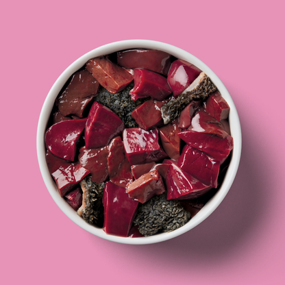 Just Raw Offal 500g: A bowl of diced beef offal, a nutrient-dense food, on a pink background.