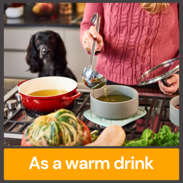 Person ladling Chicken Bone Broth 500ml in kitchen, with dog watching. Text: "As a warm drink for gut health.