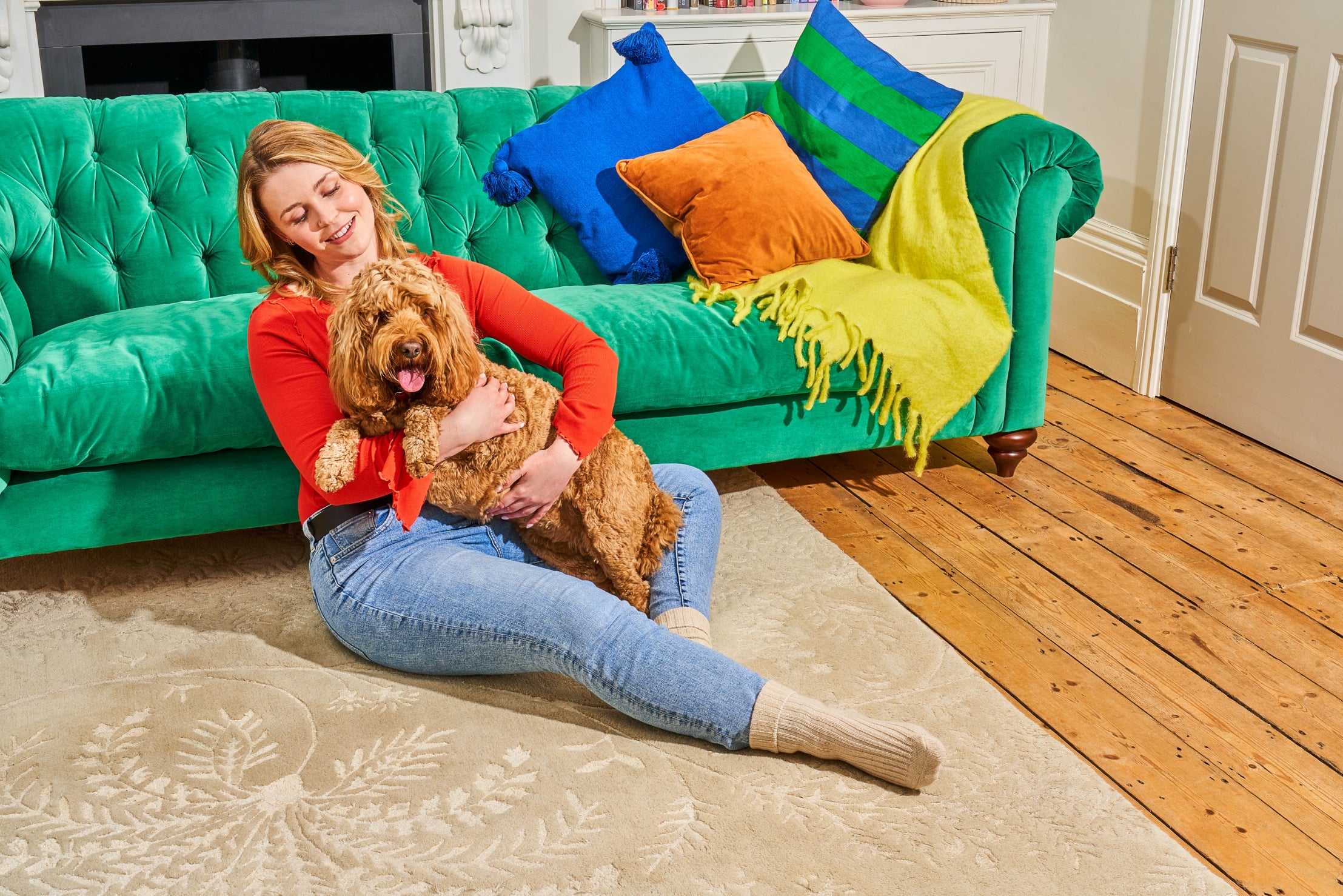 A dog lies on a woman's lap.