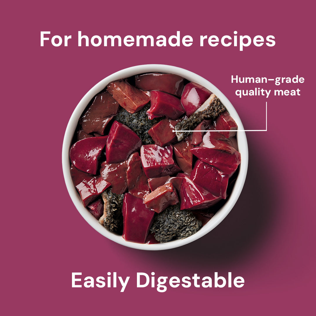 Bowl of Just Raw Offal 500g dog food with label "Human-grade quality meat" on pink background, text "For homemade recipes.