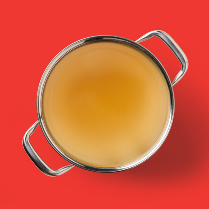 Beef Bone Broth 500ml on vibrant red, viewed from above, promising enhanced gut health.