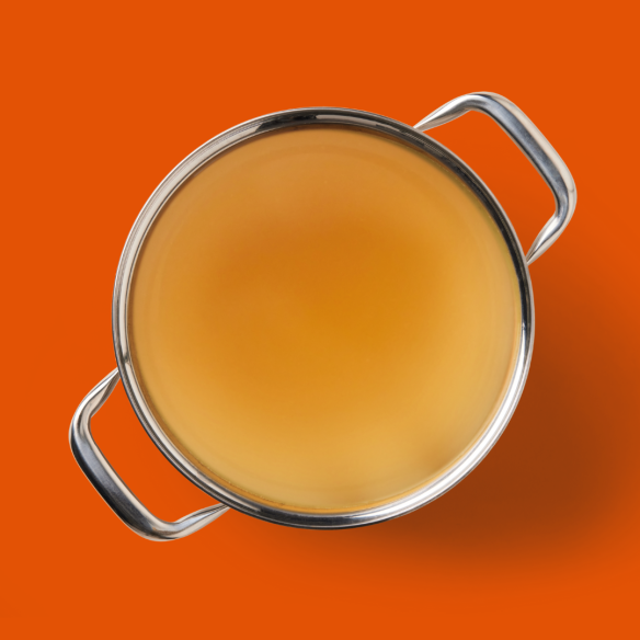 The Chicken Bone Broth 500ml, set against an orange backdrop, boosts gut health.