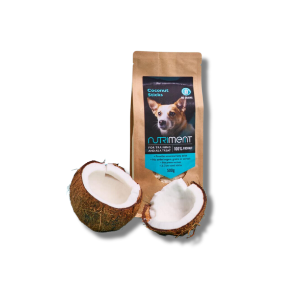 Organic Coconut Sticks 500g for dogs, featuring a playful pup and two halved coconuts in the foreground.