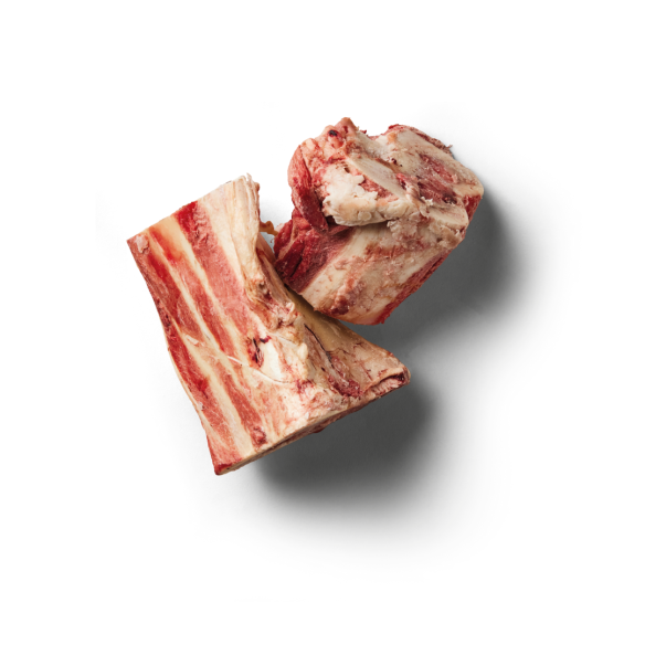 Two Marrow Bones (Pack of 2) casting shadows on a white background, rich in bone marrow.